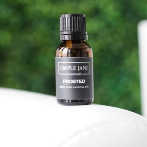 Bottle of Peppermint Essential oil on white background for red light therapy